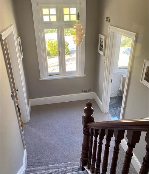 window at foot of stairs