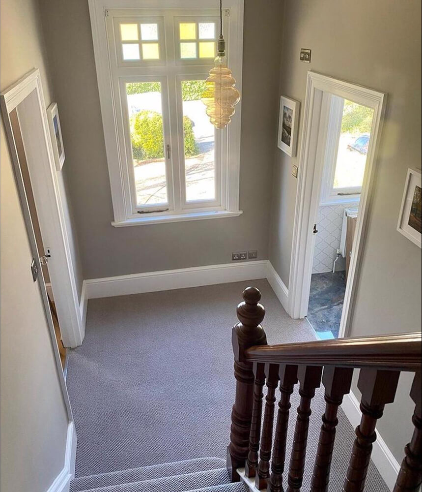 window at foot of stairs
