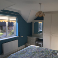 blue bedroom with white ceiling
