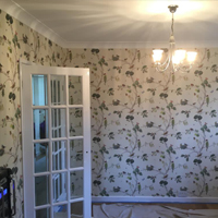 floral wallpaper with white door